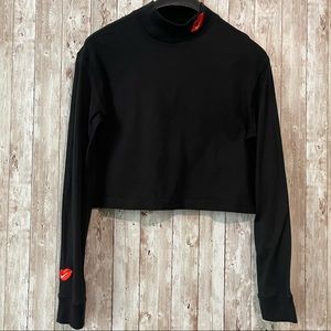 The Nike Tee Swoosh Kiss Logo Long Sleeve Crop Top